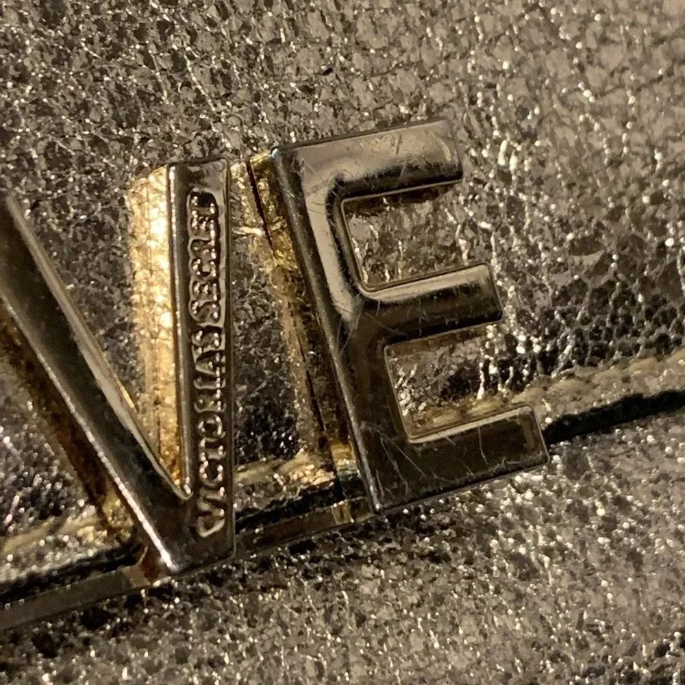 VICTORIA’S Secret shimmer phone wallet, golden